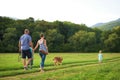 Beautiful young family with their pet dog Royalty Free Stock Photo