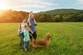 Beautiful young family with their pet dog Royalty Free Stock Photo