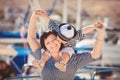 Beautiful young family of two walking along wooden jetty. Woman with son on pier Royalty Free Stock Photo