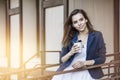 Beautiful young fashion gir with take-away coffee in hand Royalty Free Stock Photo