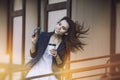 Beautiful young fashion gir with take-away coffee in hand Royalty Free Stock Photo