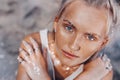 Beautiful young fashion model on the beach. Close up portrait of boho model with sparkling boho accessories