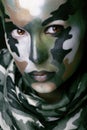 Beautiful young fashion woman with military style clothing and face paint make-up Royalty Free Stock Photo