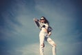 Beautiful young fashionable woman in sexy stylish denim clothes, black sunglasses, posing in the city.. Fashion photo. Royalty Free Stock Photo