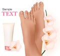 Beautiful young feet with orchids and body cream.