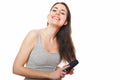 Beautiful young female combing her hair Royalty Free Stock Photo