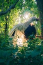 Beautiful young female with curly hair dancing in a park Royalty Free Stock Photo