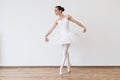 Beautiful young female dancer posing on studio background. Royalty Free Stock Photo