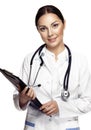 Beautiful young female doctor holding clipboard and smiling Royalty Free Stock Photo