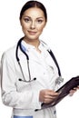 Beautiful young female doctor holding clipboard and smiling on Royalty Free Stock Photo
