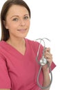 Beautiful Young Female Doctor Holding Her Stethoscope Royalty Free Stock Photo