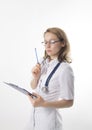 Beautiful young female doctor in medical gown and rubber gloves holding a medical records. nurse making entries in