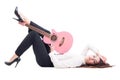 Beautiful young female guitarist lying down on white floor Royalty Free Stock Photo