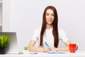 Beautiful young female manager working with documents in the office Royalty Free Stock Photo