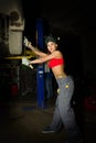 Beautiful young female mechanic inspecting car in auto repair shop. mechanic Royalty Free Stock Photo