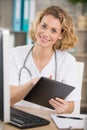 Beautiful young female medical intern with tablet Royalty Free Stock Photo