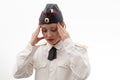 A beautiful young female Russian police officer in dress uniform in a cap and shoulder straps of a lieutenant colonel and a white