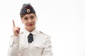 Beautiful young female Russian police officer in dress uniform shows signs with her hands on a white background Royalty Free Stock Photo