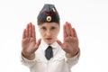 Beautiful young female Russian police officer in dress uniform shows a stop sign with her hands on a white background. Royalty Free Stock Photo