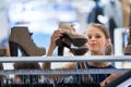 Beautiful young female shopper in a clothing store Royalty Free Stock Photo