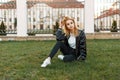 Beautiful young female student in a stylish jacket