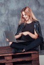 Beautiful young female woman chatting with friends using laptop computer while sitting in cafe. Concept people, emotions Royalty Free Stock Photo