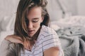 Beautiful young feminine woman relaxing in bedroom in lazy weekend morning Royalty Free Stock Photo