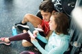 Fit couple in modern crossfit gym with smartphone. Royalty Free Stock Photo