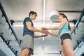 Beautiful young fit couple in modern gym. Royalty Free Stock Photo