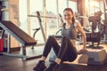 Beautiful young fit woman doing push up on fitness stepper at gym. Royalty Free Stock Photo