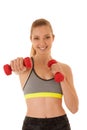 Beautiful young fit woman works out with dumbbells isolated over Royalty Free Stock Photo