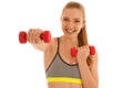 Beautiful young fit woman works out with dumbbells isolated over Royalty Free Stock Photo