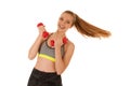 Beautiful young fit woman works out with dumbbells isolated over Royalty Free Stock Photo