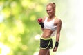 Young fitness woman happy smiling holding apple