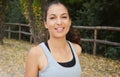 Beautiful young fitness woman running in the park. Smiling girl training outdoors Royalty Free Stock Photo