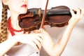 Beautiful young folk woman playing violin Royalty Free Stock Photo