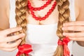 A beautiful young folk woman presents her long tresses Royalty Free Stock Photo
