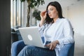 Beautiful Young Freelancer Woman Using Laptop Computer Sitting At Cafe Table. Happy Smiling Girl Working Online Or Royalty Free Stock Photo