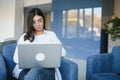 Beautiful Young Freelancer Woman Using Laptop Computer Sitting At Cafe Table. Happy Smiling Girl Working Online Or Royalty Free Stock Photo