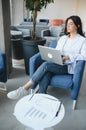 Beautiful Young Freelancer Woman Using Laptop Computer Sitting At Cafe Table. Happy Smiling Girl Working Online Or Royalty Free Stock Photo