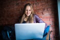 Beautiful Young Freelancer Woman Using Laptop Computer Sitting At Cafe Table. Happy Smiling Girl Working Online Or Studying And Le Royalty Free Stock Photo