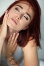 Beautiful young ginger woman with freckles and blue eyes. Portrait of charming girl wearing casual clothes Royalty Free Stock Photo