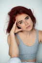 Beautiful young ginger woman with freckles and blue eyes. Portrait of charming girl wearing casual clothes posing at home, looking Royalty Free Stock Photo