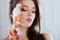 Beautiful young girl with applique flowers on the face. Royalty Free Stock Photo