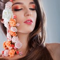 Beautiful young girl with applique flowers on the face. Royalty Free Stock Photo