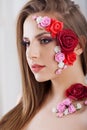 Beautiful young girl with applique flowers on the face. Royalty Free Stock Photo