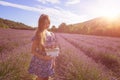 Girl with a basket of lavender flowers in a blooming lavender field, Provence, France Royalty Free Stock Photo