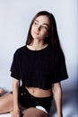 Beautiful young girl in black shorts and t-shirt Royalty Free Stock Photo