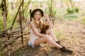 Beautiful young girl with blond hair in a suede jacket with fringed and black felt hat in the countryside on a sunny autumn day Royalty Free Stock Photo