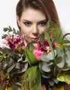 Beautiful young girl with a bouquet of flowers Royalty Free Stock Photo